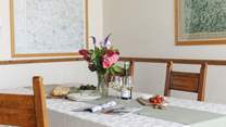 Share a delicious meal around the spacious dining-table.