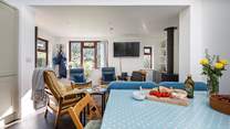 The sociable living area has a large dining-table.