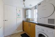 The handy utility-room has a washing machine and tumble-drier.