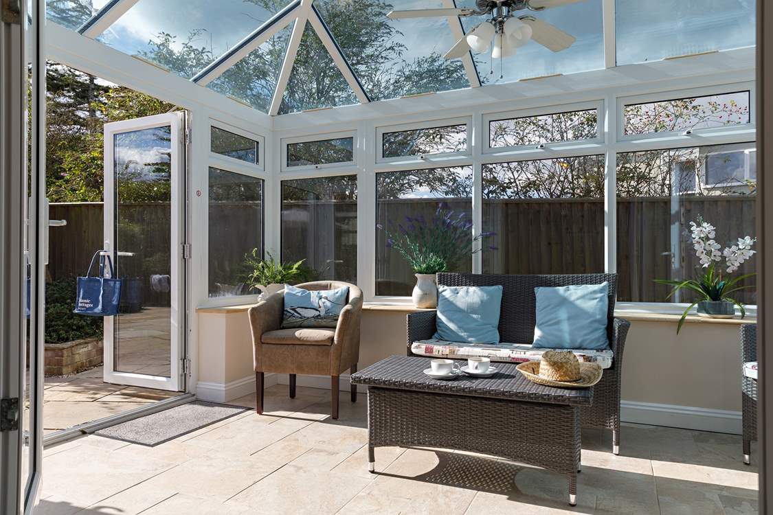 On cooler days the conservatory is perfect for morning coffee or afternoon tea.