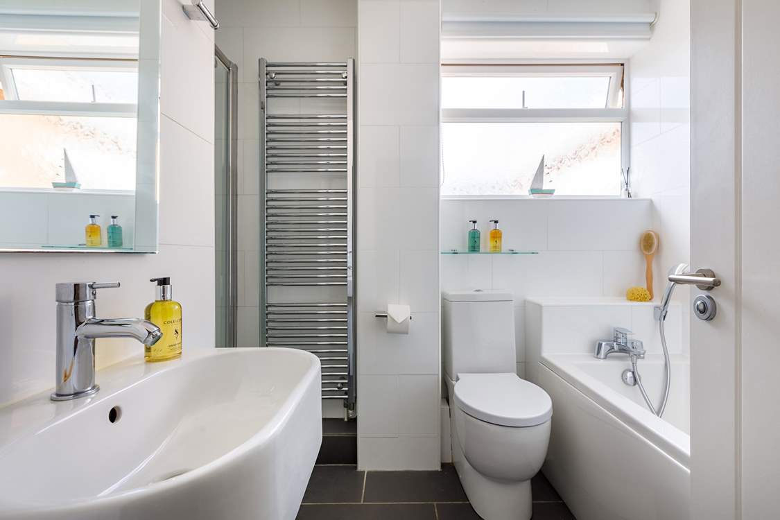 The bathroom on the ground floor has a bath and a separate shower cubicle.