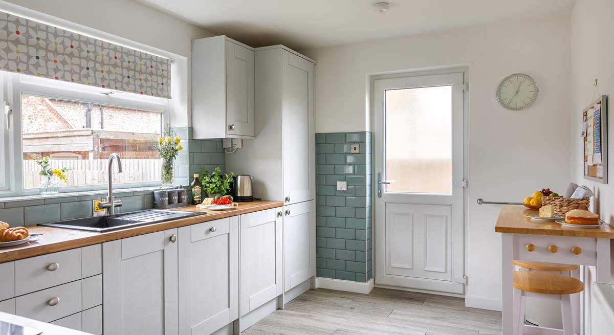 The kitchen has a handy breakfast-bar, perfect for perching whilst chatting with the chef. 