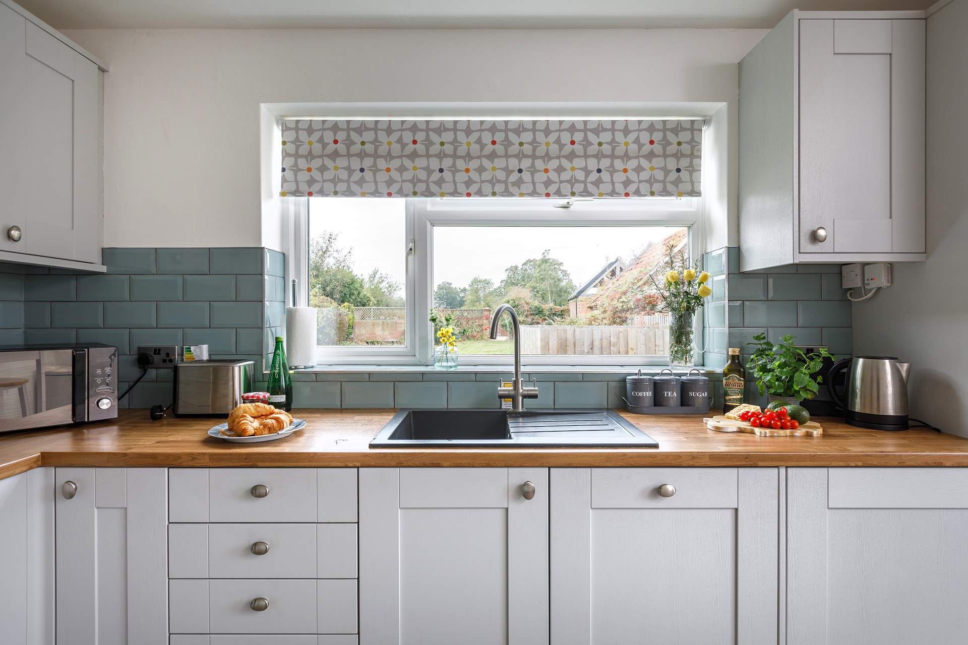 The view of the garden from the kitchen window is delightful. 
