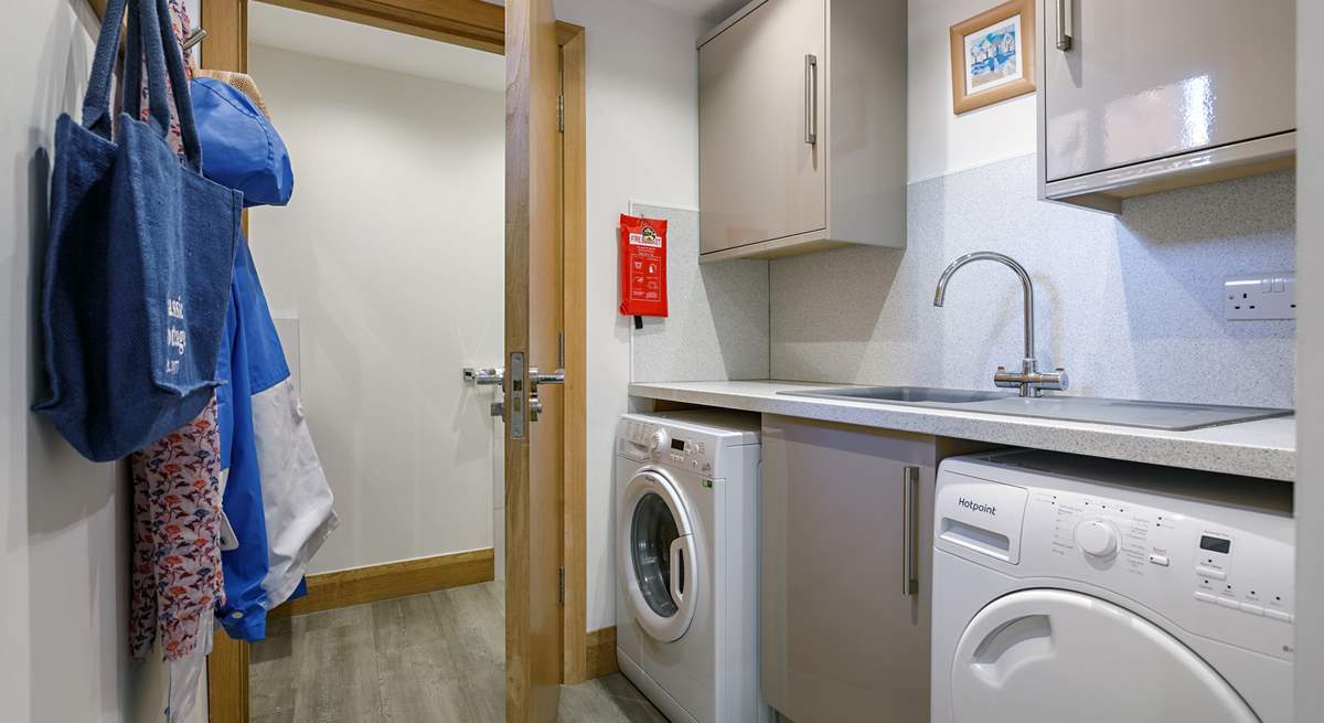 The handy utility-room has a washing machine and tumble-drier. 