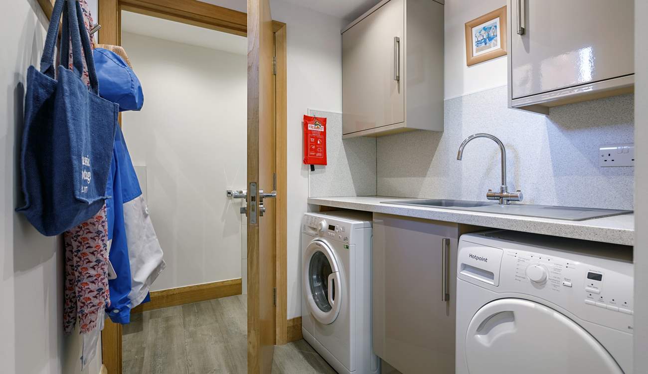 The handy utility-room has a washing machine and tumble-drier. 