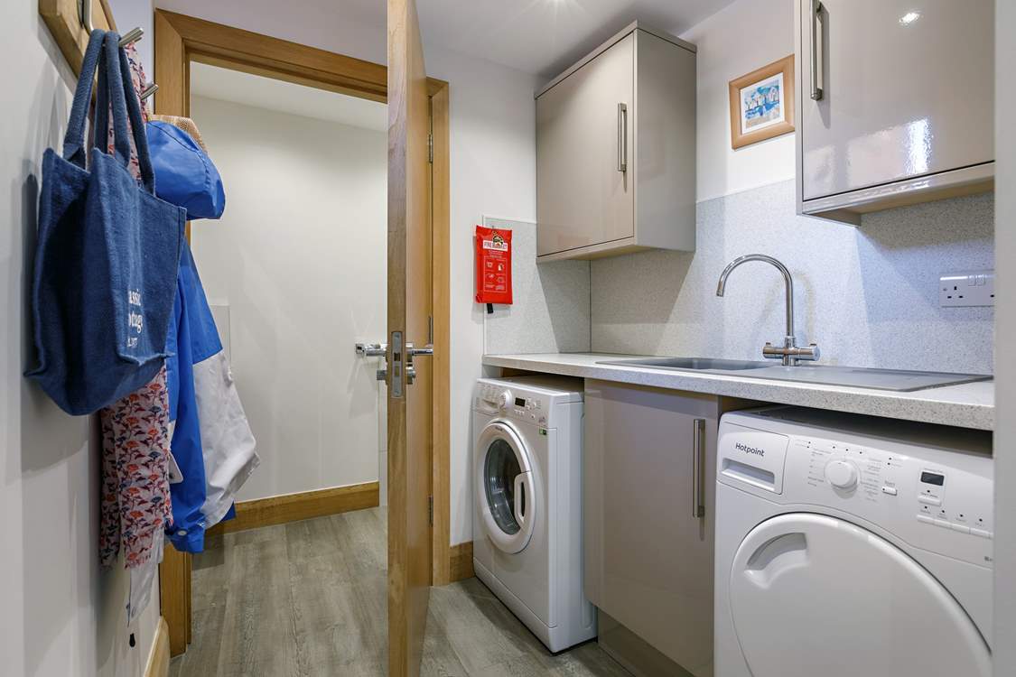 The handy utility-room has a washing machine and tumble-drier.