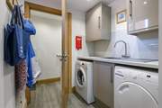 The handy utility-room has a washing machine and tumble-drier.