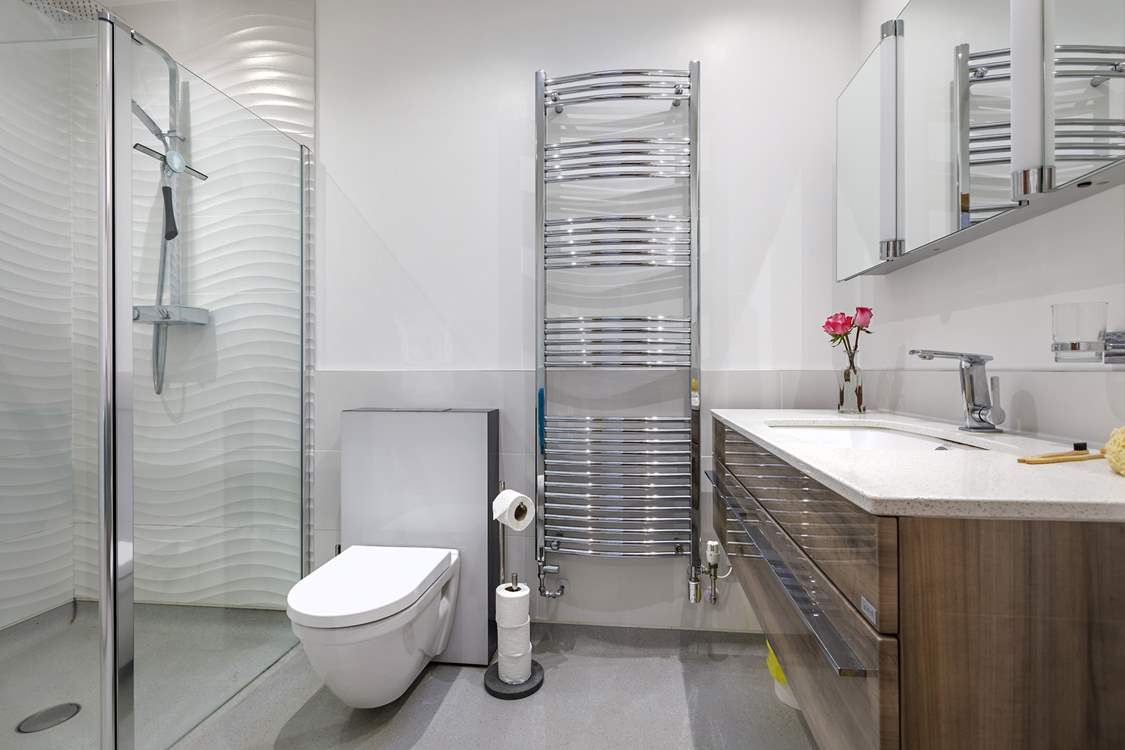 One of the en suite shower-rooms with large walk-in rainfall shower.