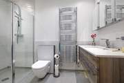 One of the en suite shower-rooms with large walk-in rainfall shower.