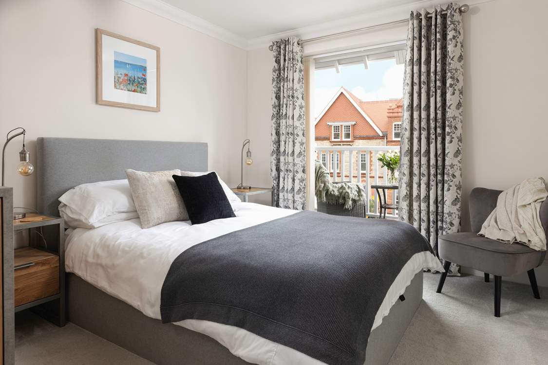 Bedroom 1 opens out on to the balcony - enjoy a morning coffee watching the sea.