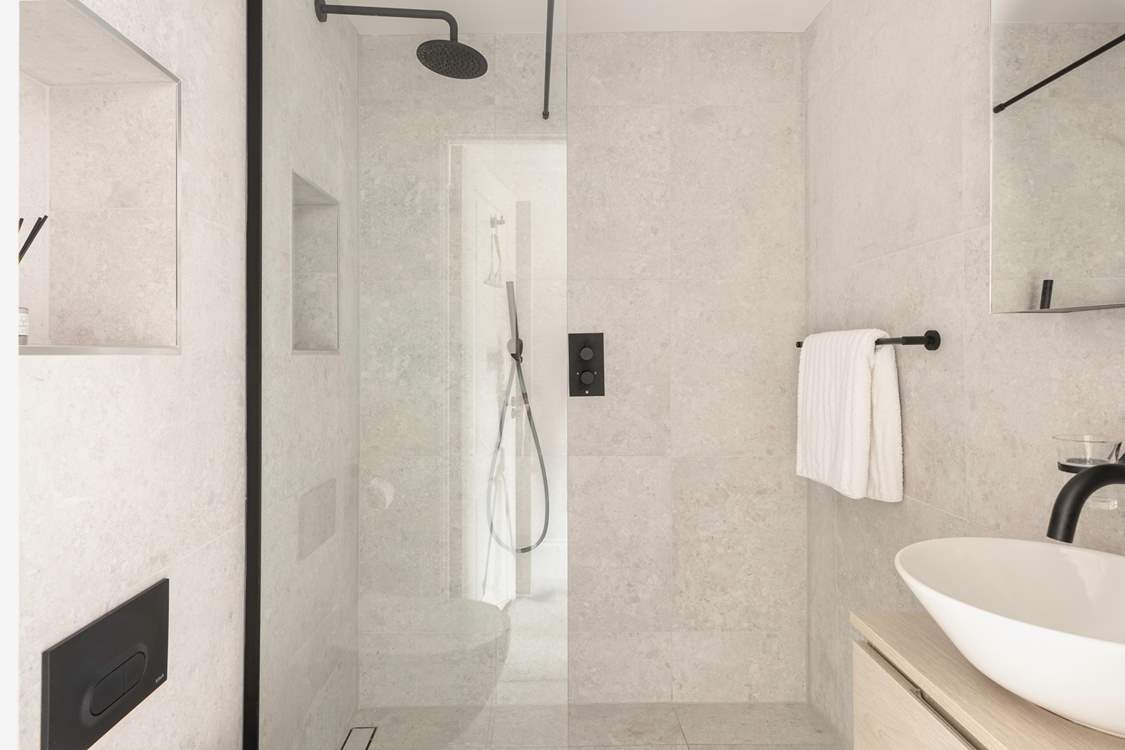 Bedroom 1 boasts an en suite wet-room.