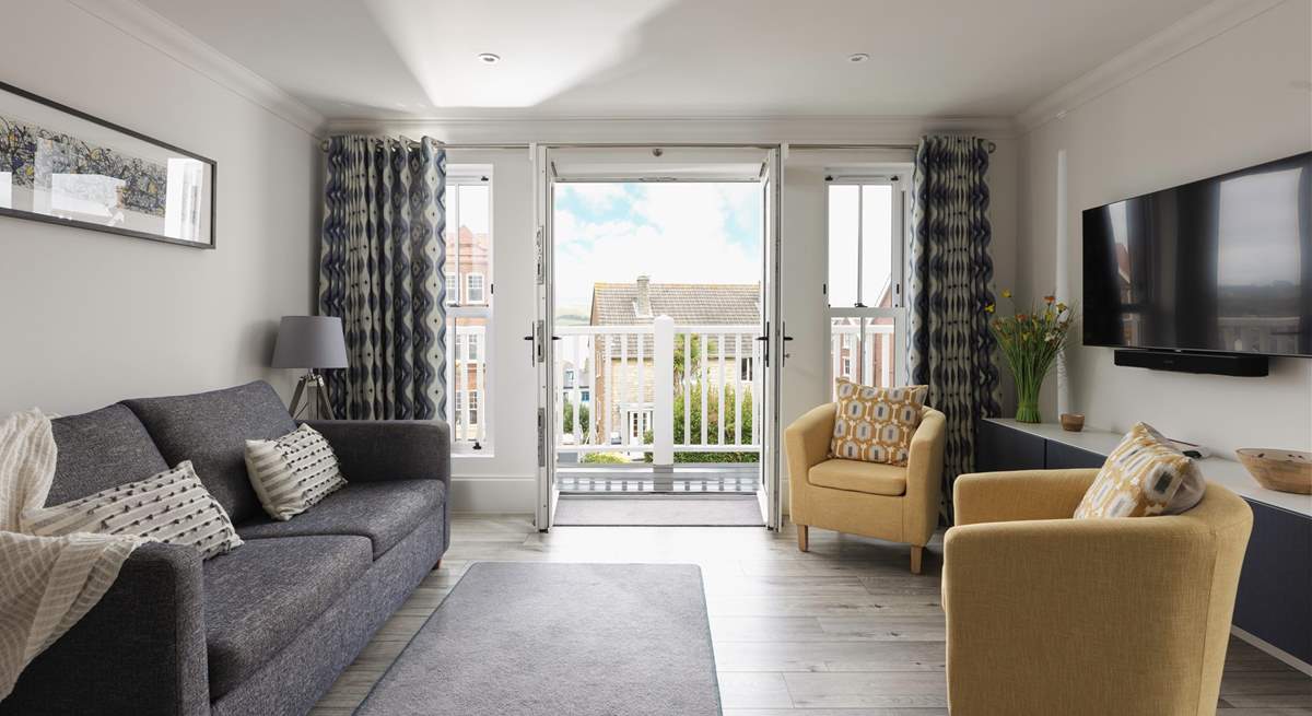 A beautifully stylish space with a balcony that has views across Swanage Bay.