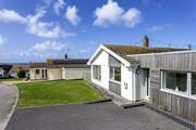 As you arrive at this property you can catch sea views in the distance.
