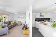The open plan living area in this modern bungalow is designed to feel light and airy.