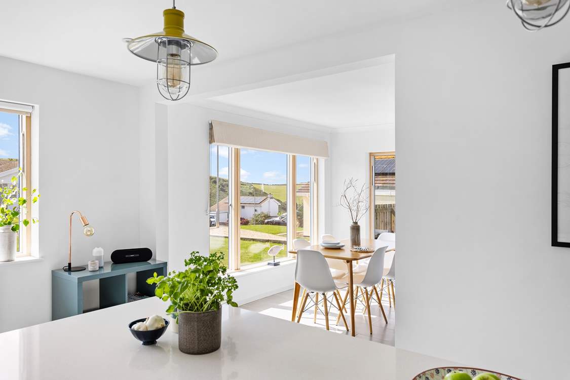 Views of this fantastic location fill the floor to ceiling window in the open plan dining-area.