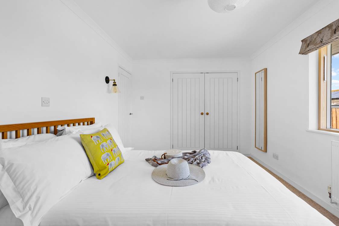 A large built-in wardrobe provides oodles of storage.