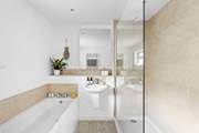 The family bathroom with both a bath and a separate power shower, keeping everyone happy.