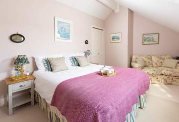 This pretty pink bedroom has a cosy reading corner (bedroom 2). 