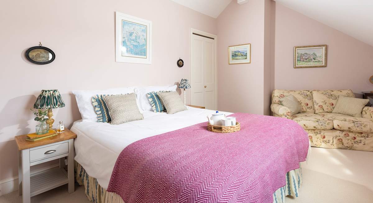 This pretty pink bedroom has a cosy reading corner (bedroom 2). 