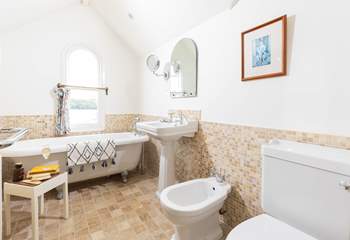 Enjoy a long soak in the roll-top bath with a good book or look out at the view. 