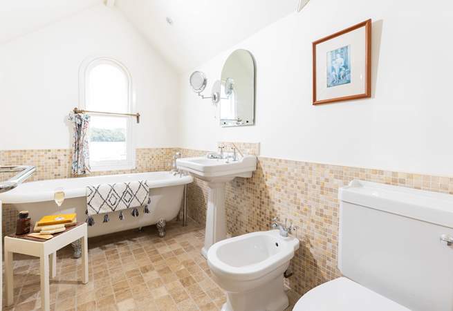 Enjoy a long soak in the roll-top bath with a good book or look out at the view. 