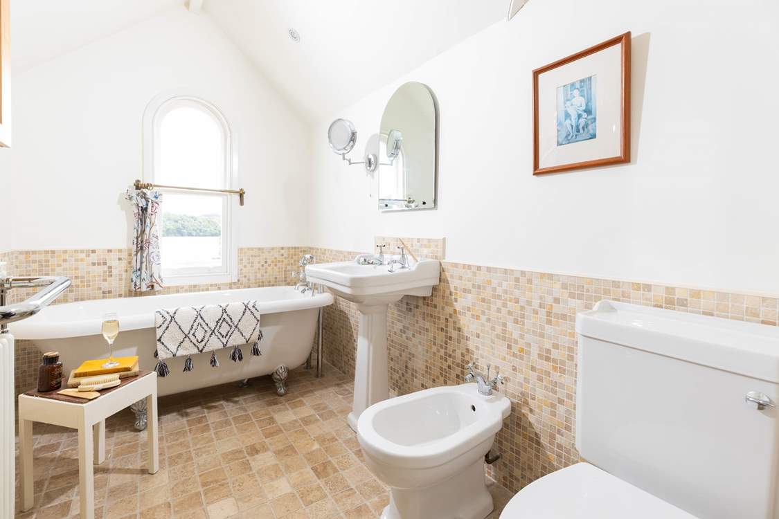 Enjoy a long soak in the roll-top bath with a good book or look out at the view.