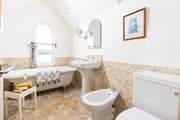 Enjoy a long soak in the roll-top bath with a good book or look out at the view.