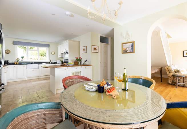 The open plan living space is so light and airy, there are two extra chairs for a party of six.  The ground floor bedroom leads off to the right along with the wet-room. 