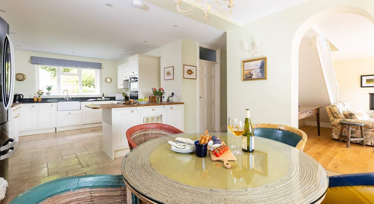 The open plan living space is so light and airy, there are two extra chairs for a party of six.  The ground floor bedroom leads off to the right along with the wet-room. 