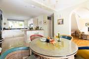 The open plan living space is so light and airy, there are two extra chairs for a party of six.  The ground floor bedroom leads off to the right along with the wet-room.
