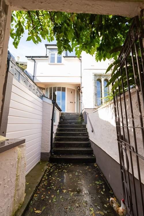 Through the gate and to your front door, you have reached Condurro House.