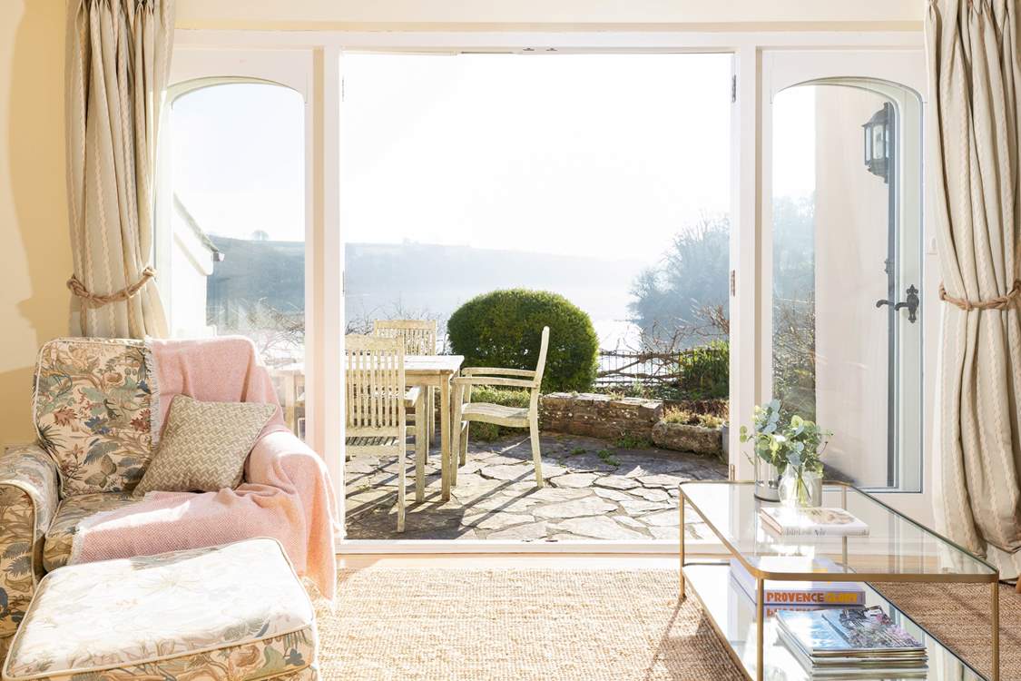 Open the double doors to the sunny terrace.