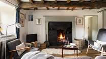 The fire crackles in the original black leaded range.