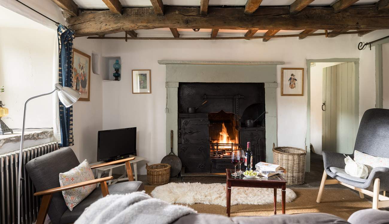 The fire crackles in the original black leaded range.