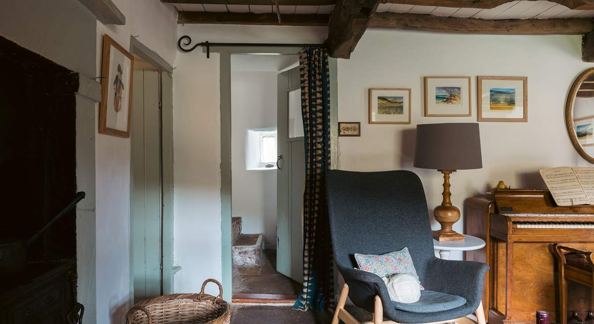 Peeking through from the sitting-room to the original stone staircase.