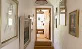 Eclectic artwork adorns the upstairs hallway. - Thumbnail Image