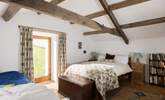 Beautiful old beams in this relaxing bedroom. - Thumbnail Image