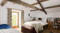Beautiful old beams in this relaxing bedroom.