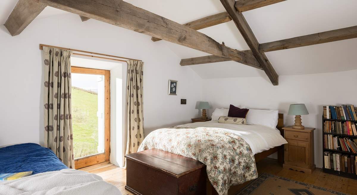 Beautiful old beams in this relaxing bedroom.