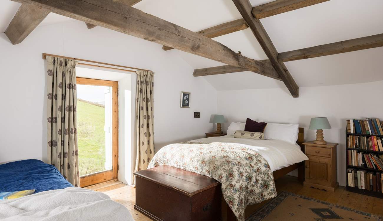 Beautiful old beams in this relaxing bedroom.