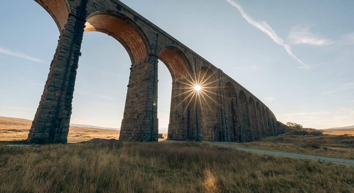 The sun shining through the Ribblehead Viaduct.