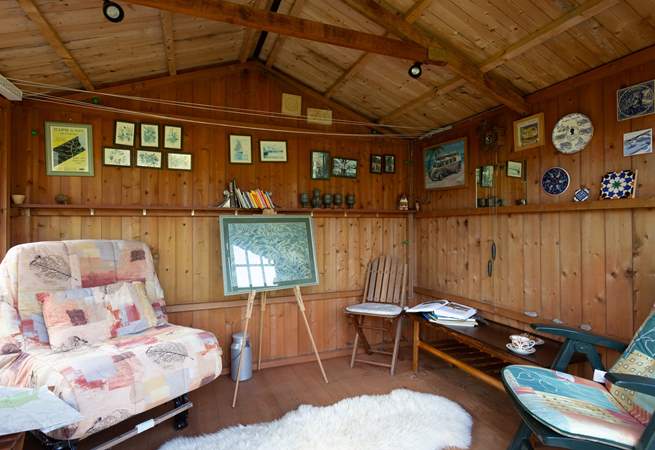 Why not make use of this summer-house when the sun isn't shining.