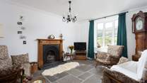 The sitting-room is full of olde worlde charm.