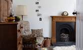 Cosy up in front of the open fire on cooler evenings. - Thumbnail Image
