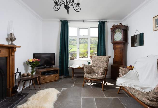 Check out the time on the grandfather clock.