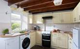 The well-equipped kitchen opens onto the garden. - Thumbnail Image