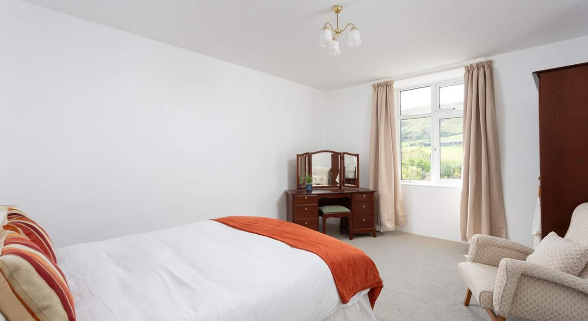Another spacious bedroom with views.
