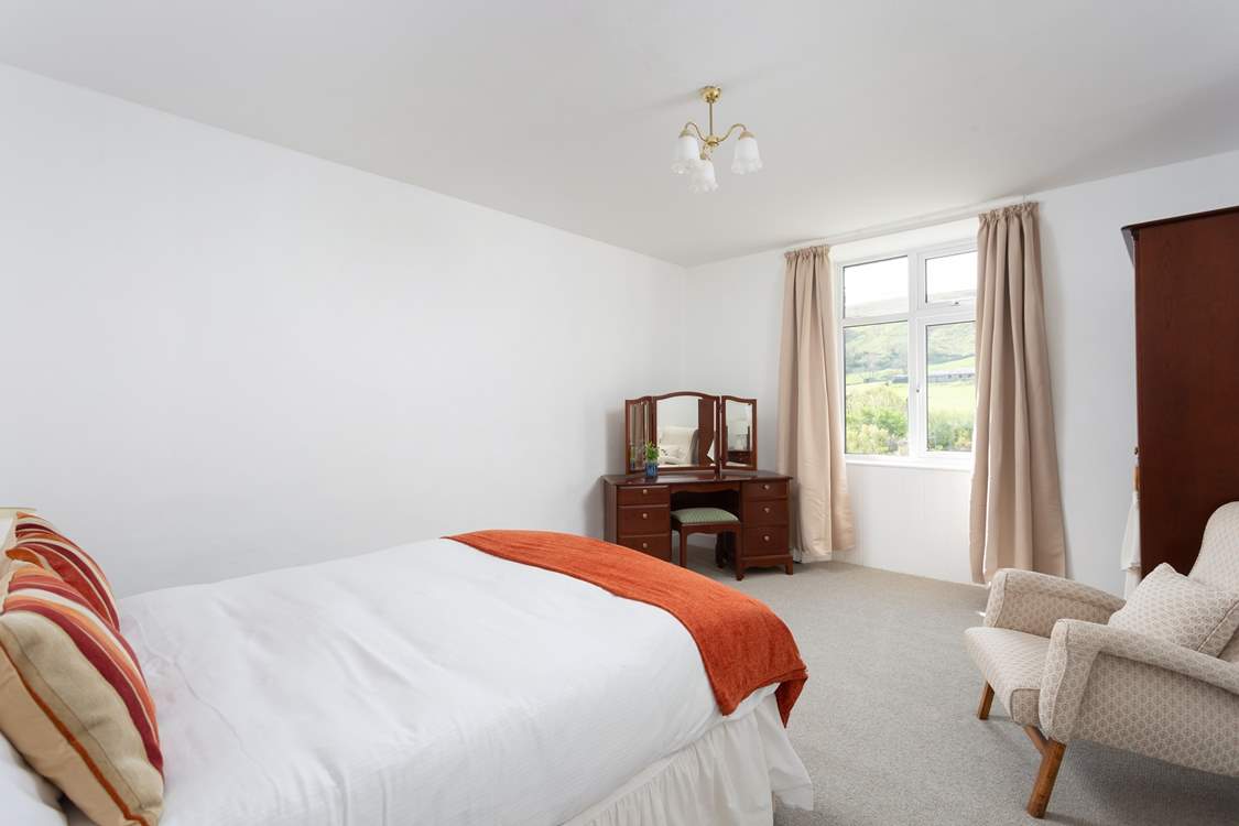 Another spacious bedroom with views.