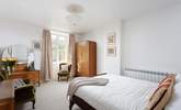 This spacious bedroom could be yours for your stay. - Thumbnail Image