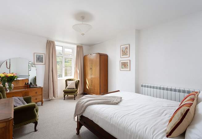 This spacious bedroom could be yours for your stay.